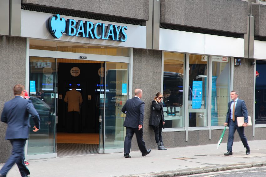image of a bank and people outside it 