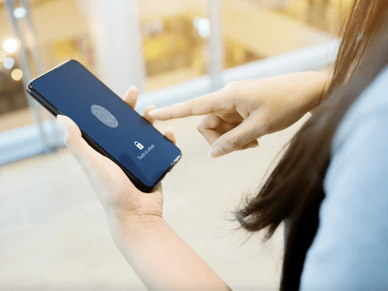 Woman using biometrics on smartphone