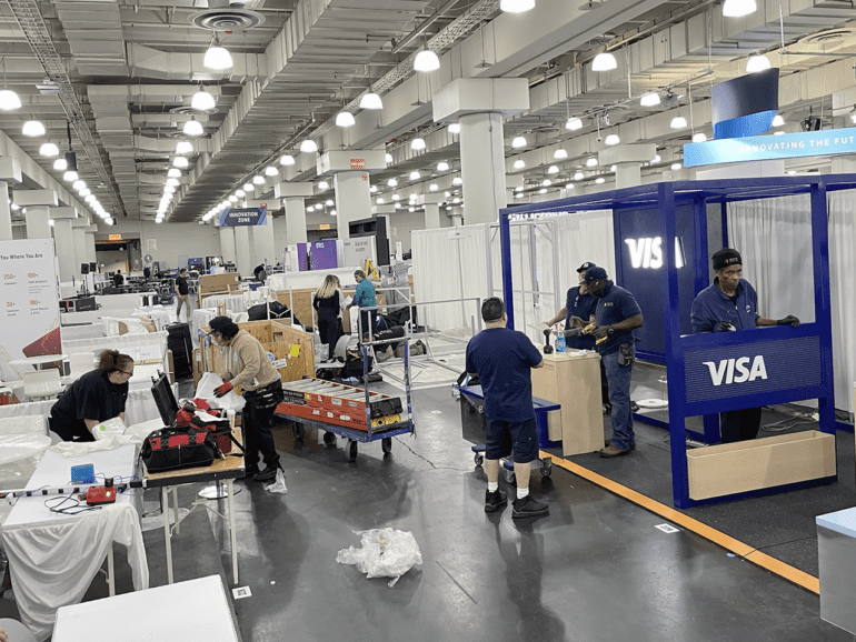 Vendors, staffers and contractors were busy building and setting up booths at the expo hall for Fintech Nexus USA 2023 at the Javits Center in New York on Tuesday, May 9, 2023.
