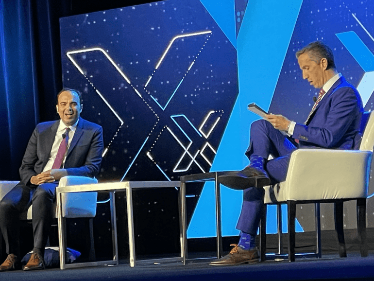 Phil Goldfeder, CEO of American Fintech Council, right, interviews Rohit Chopra, Director, Consumer Financial Protection Bureau, on the keynote stage at Fintech Nexus USA 2023 at the Javits Center in New York City. | John K. White, Fintech Nexus